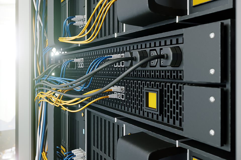 Server racks inside a data center aisle containment enclosure