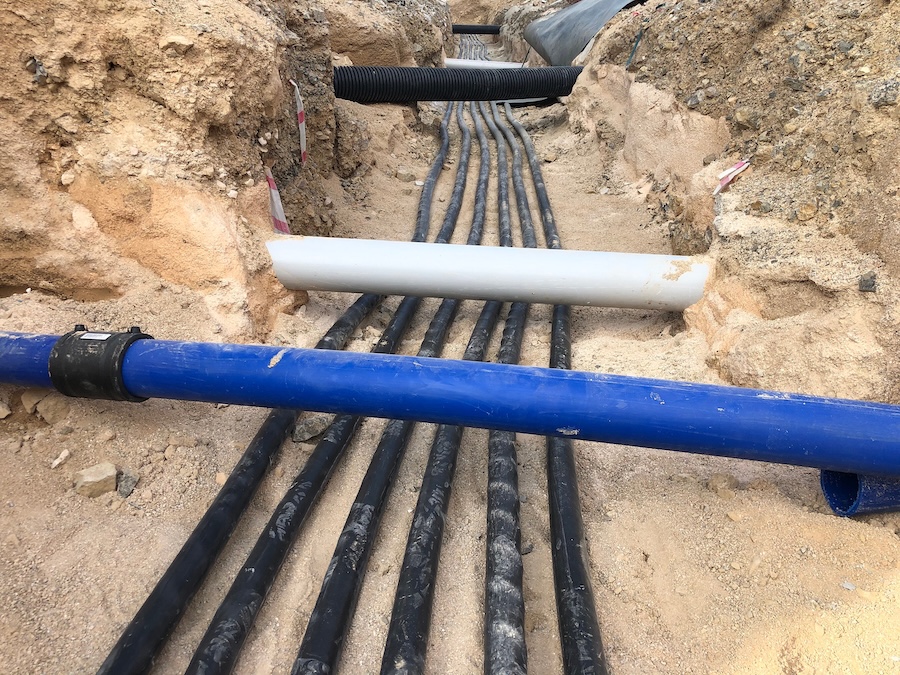 High-voltage electrical cables laid in a trench for data center infrastructure